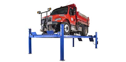 SM30 commercial vehicle lift holding up a dump truck
