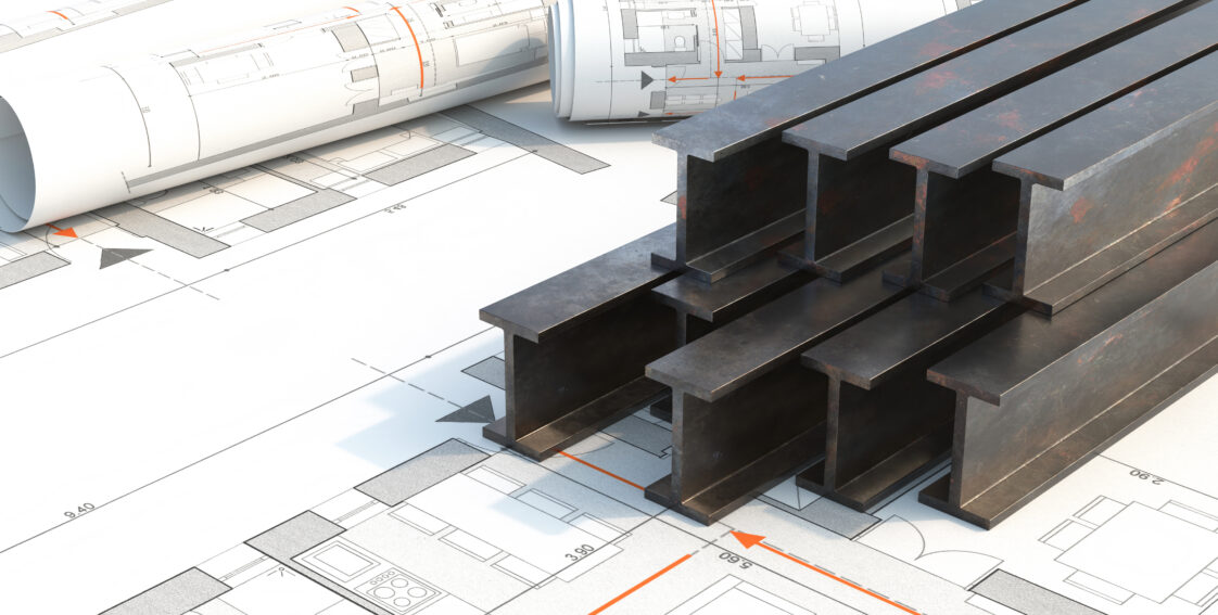 Steel beams that are slightly rusted are placed on top of a general design blueprint.